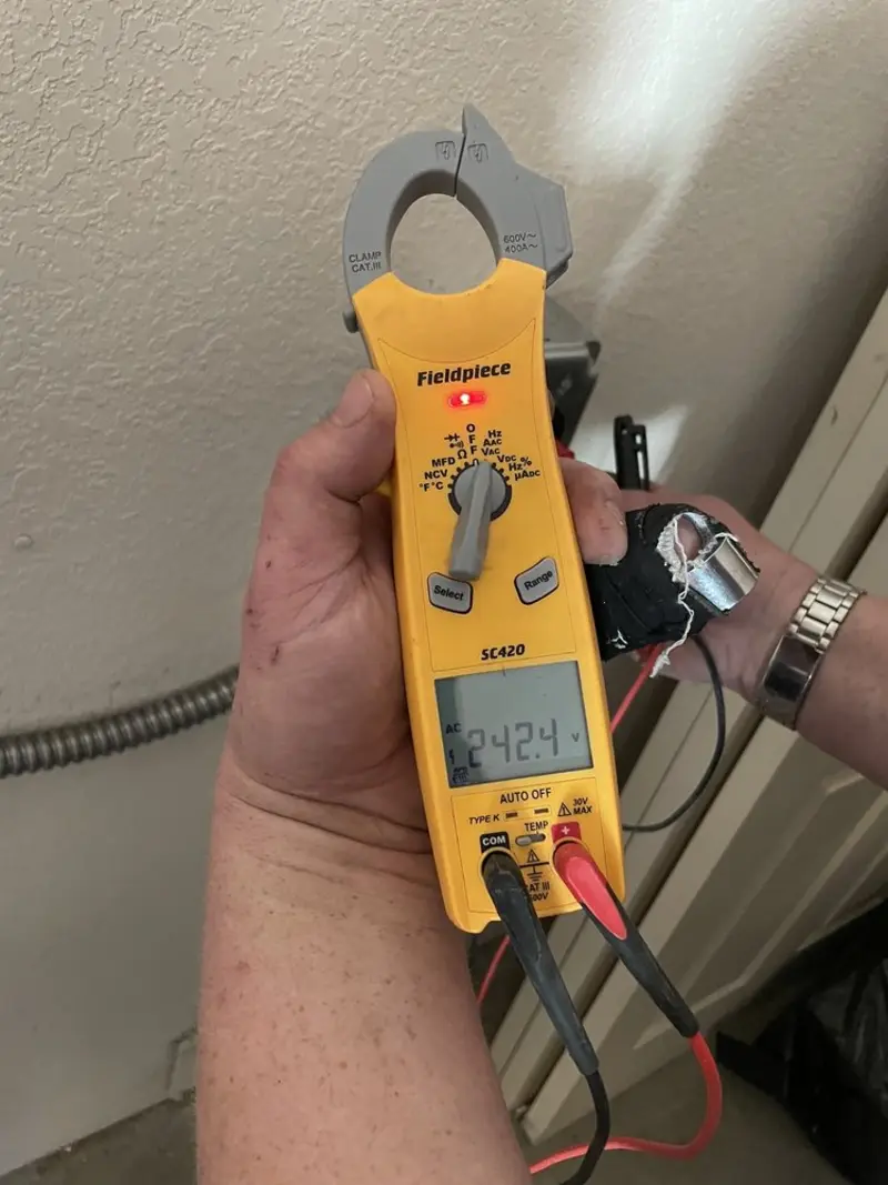 Voltage testing with clamp meter during Outlet Installation in Huntingdon